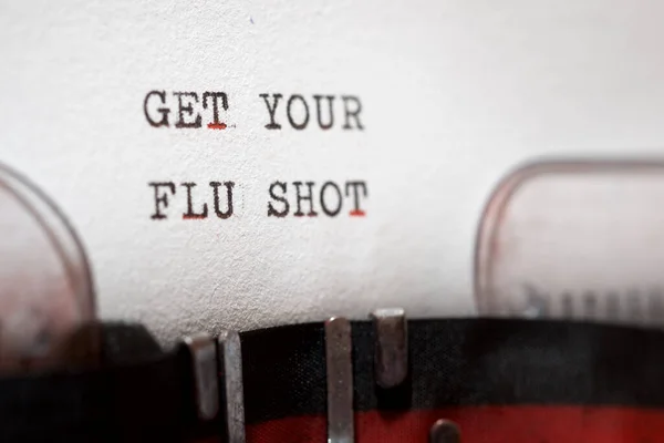 Get your flu shot phrase written with a typewriter.