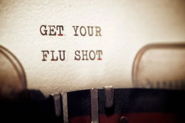 Get your flu shot phrase written with a typewriter.
