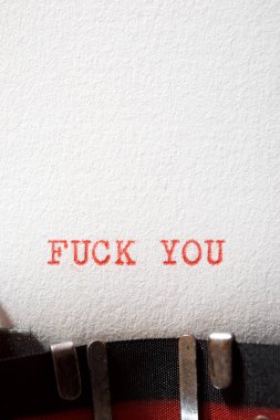 Fuck you text written with a typewriter.