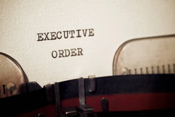 Executive order phrase written with a typewriter.