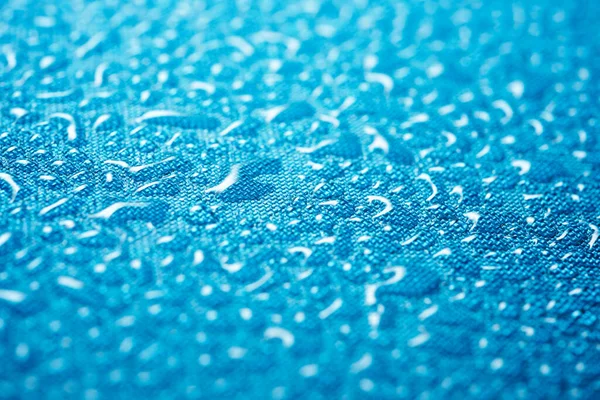 Close-up of the fabric of a waterproof mountain backpack.