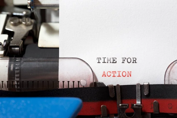 Time for action phrase written with a typewriter.