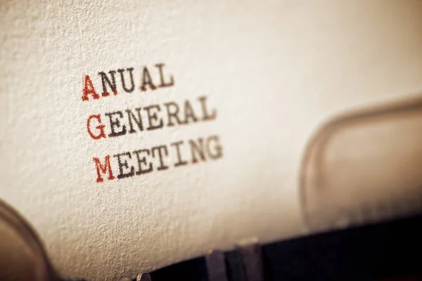 Anual general meeting phrase written with a typewriter.