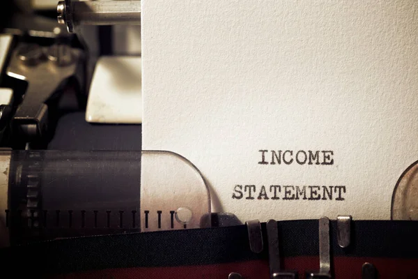 Income statement phrase written with a typewriter.