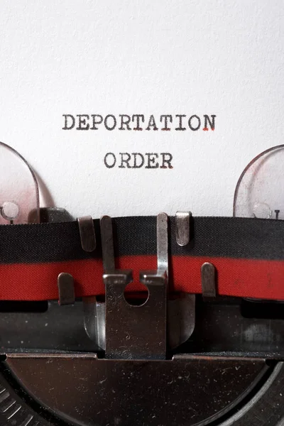 Deportation order phrase written with a typewriter.