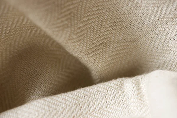 Close-up of a beige colored fabric.