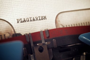 The word plagiarism written with a typewriter. clipart