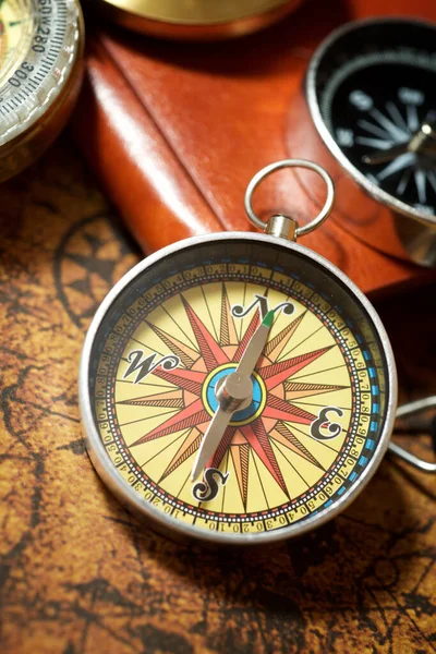 Vintage compass and old navigation map.