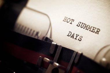 Hot summer days phrase written with a typewriter.