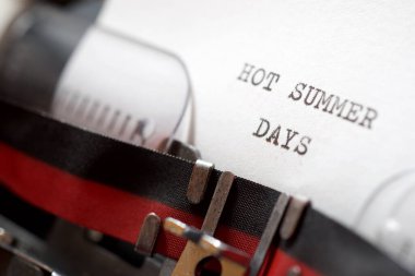 Hot summer days phrase written with a typewriter.