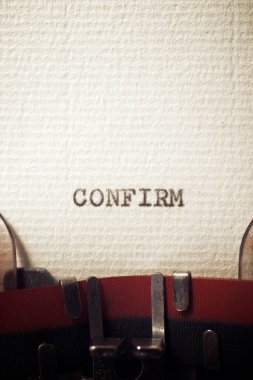 The word confirm written with a typewriter.