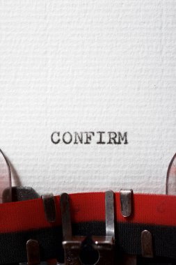 The word confirm written with a typewriter.