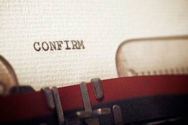 The word confirm written with a typewriter.
