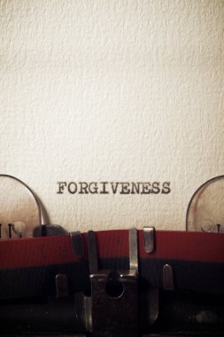 The word forgiveness written with a typewriter.