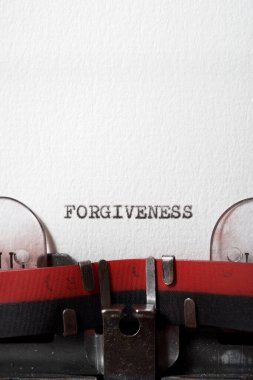 The word forgiveness written with a typewriter.