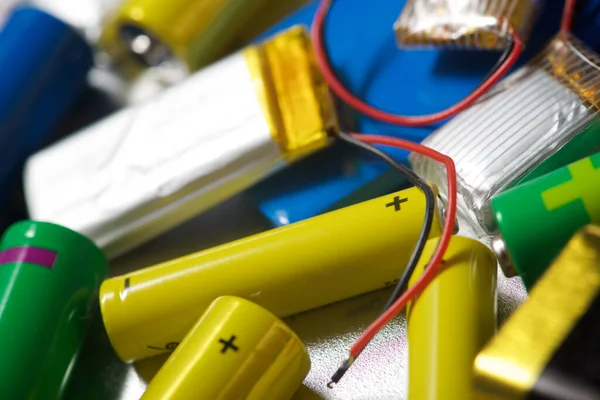 Many Batteries Metal Table — Stock Photo, Image