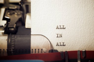 All in all phrase written with a typewriter.