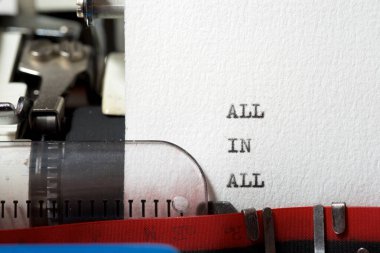 All in all phrase written with a typewriter.