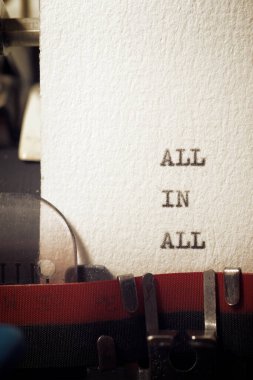 All in all phrase written with a typewriter.