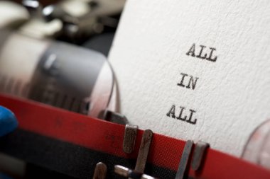 All in all phrase written with a typewriter.