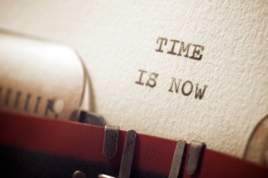 Time is now phrase written with a typewriter.
