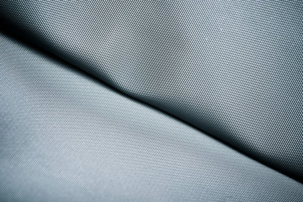 Close-up of the fabric of a waterproof mountain backpack.