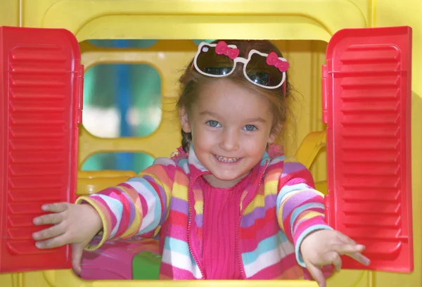 Girl in children's house — Stock Photo, Image