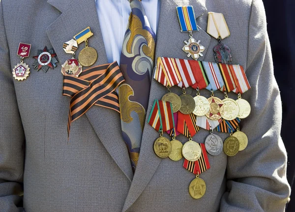 Orden und Medaillen auf seiner Jacke Stockbild