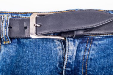 Studio lighting. blue jeans, wearing a black belt on a white background. No isolation. front pocket