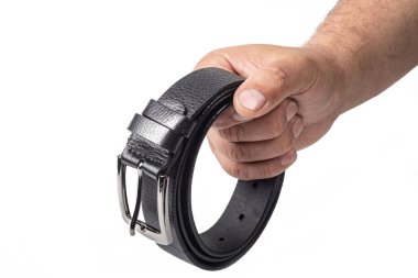 Stüdyo ışıkları. Siyah erkek kemeri. arkaplan beyaz yakın plan