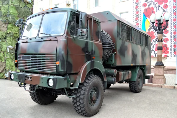 police and military camouflaged service truck