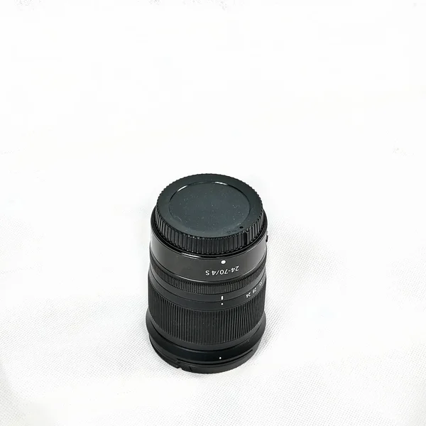 Black camera lens stading on white background — Stock Photo, Image