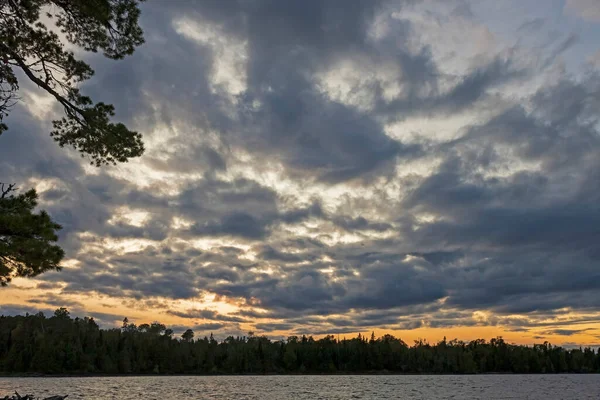 Twilight Glow Under Evening Clouds on Saganaga Lake in the Boundary Waters in Minnesota