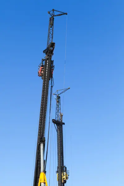 Machines for drilling and the installation of piles — Stock Image Machines for drilling and the installation of piles Royalty Free Stock Photos