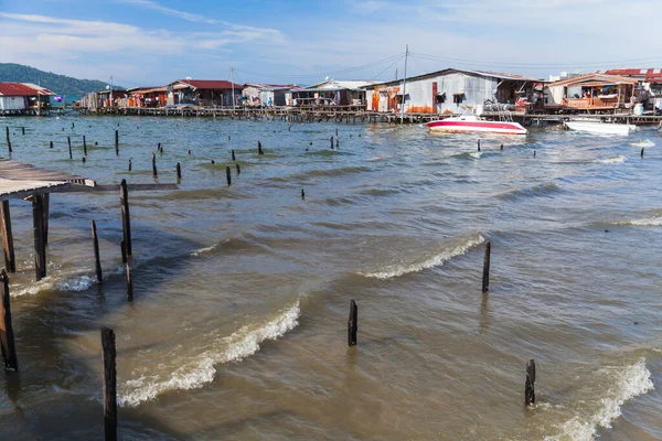 Wooden houses and footbridges on stilts. Landscape of the poor district of Sabah, Kota Kinabalu, Malaysia — Stock Image Wooden Houses Footbridges Stilts Landscape Poor District Sabah Kota Kinabalu Royalty Free Stock Images