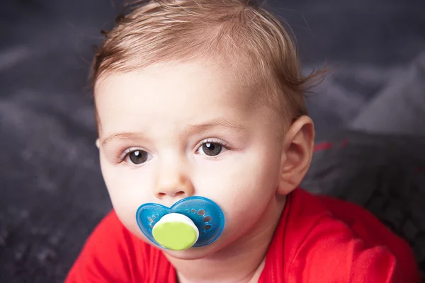 Cute baby with pacifier — Stock Photo, Image
