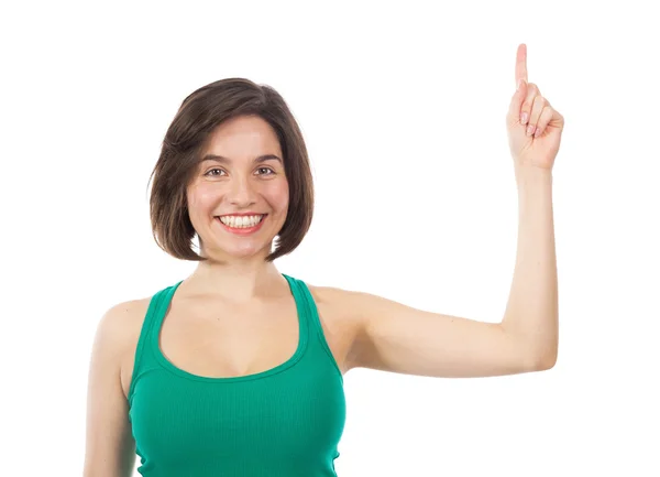 Pretty brunette pointing to the top — Stock Photo, Image