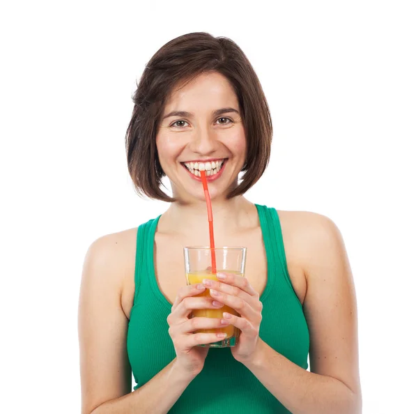 Sorrindo morena e suco de laranja — Fotografia de Stock