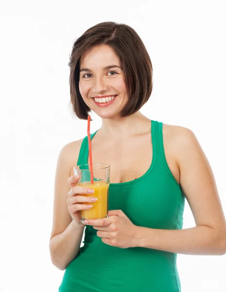 Beautiful brunette drinking an orange juice — Stock Photo, Image