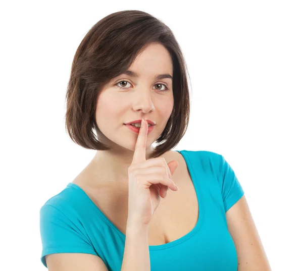 Brunette with her finger on her lips — Stock Photo, Image
