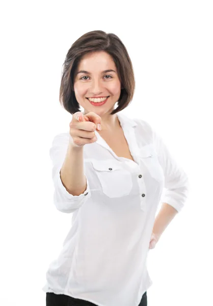 Vrolijke brunette wijzen op de voorgrond plaatsen — Stockfoto