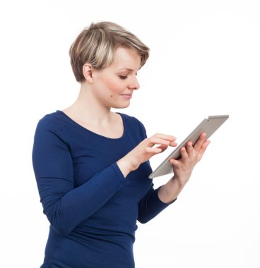Blond young woman using a touchpad