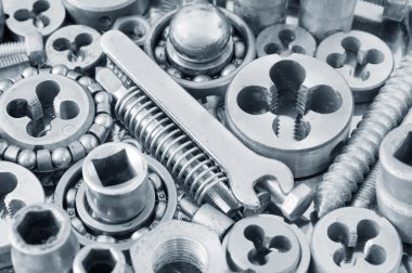 pek çok fındıklı metal vidaların arka planı.