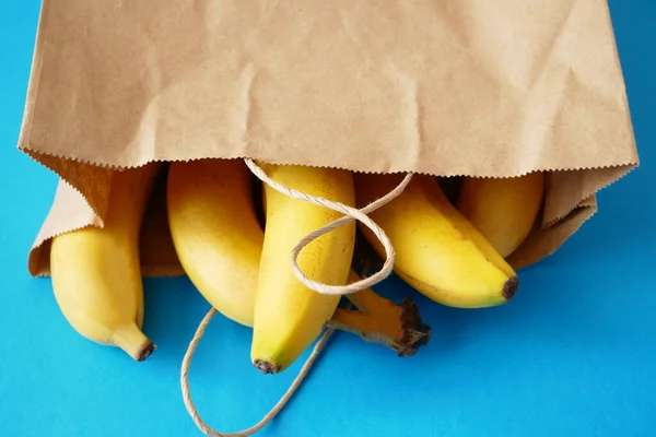 many bananas in paper bag, zero waste concept, closeup