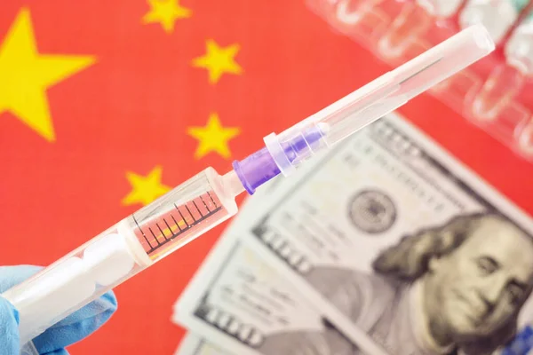 China flag, syringes with coronavirus vaccine and money, money for purchase and production vaccine