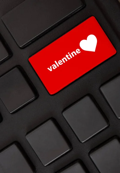 key button with heart sign on a computer keyboard, valentine\'s day concept, closeup