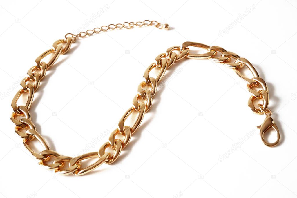 Big golden chain isolated on white background, closeup