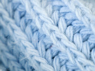 Örgü yün kumaşın ayrıntıları. Tekstil arka planı. Yünlü doku arka planı, örgü yün kumaş, tüylü yumuşacık tekstil. Yakın çekim.