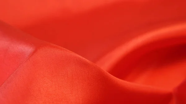 Red fabric texture, silk background, surface, closeup