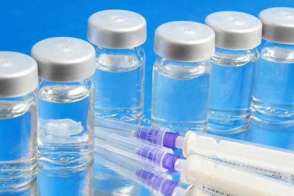 bottles of covid-19 coronavirus vaccine, production medicine vaccine, closeup